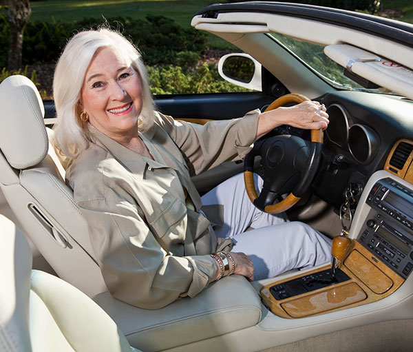 senior woman sitting in driver